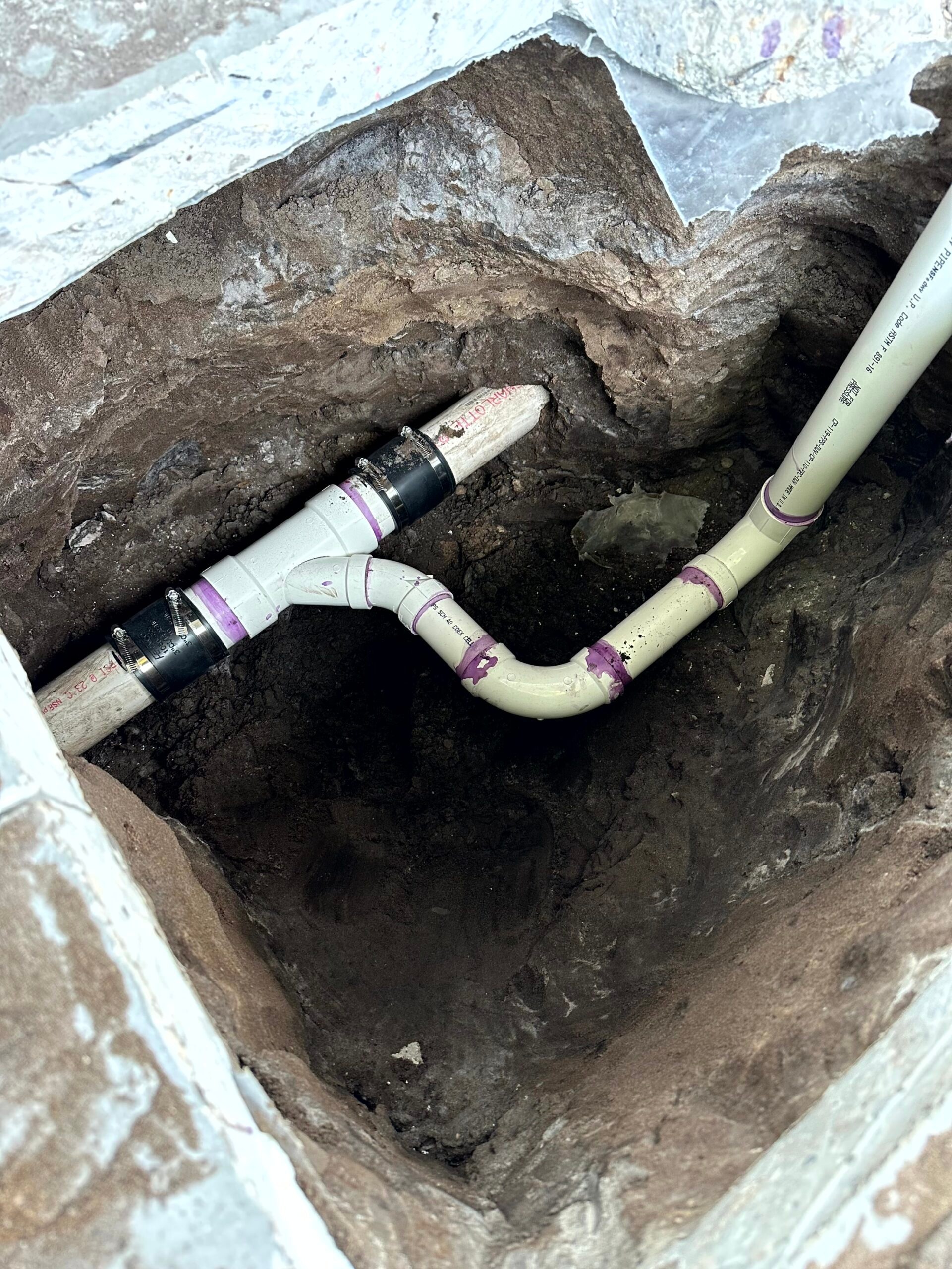 PVC pipes in a trench.